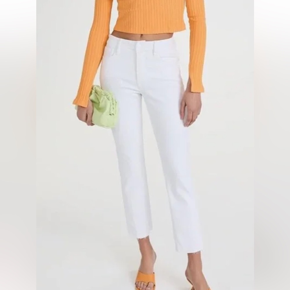 Good American white cropped jeans with raw hem